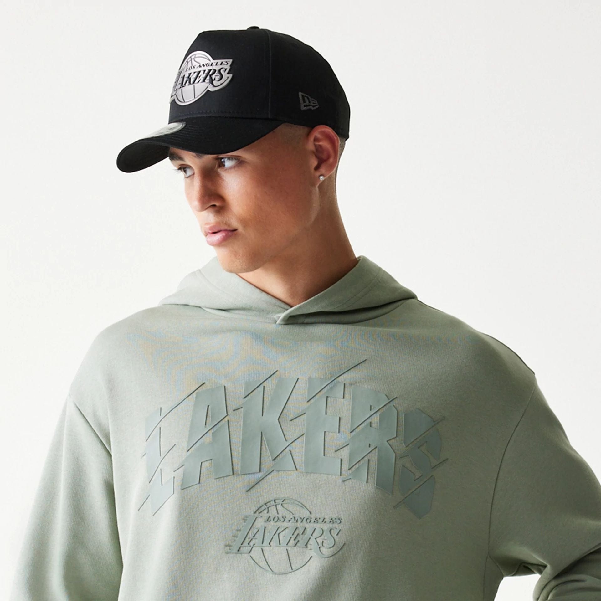 The model is wearing this NBA LA Lakers Oversized Pullover Hoodie in pastel green. 6