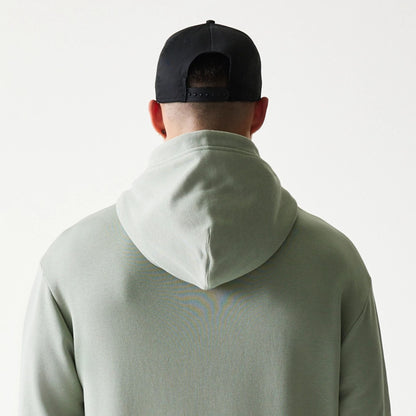 The model is wearing this NBA LA Lakers Oversized Pullover Hoodie in pastel green. 7