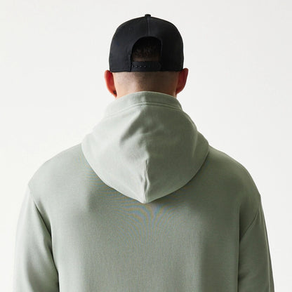 The model is wearing this NBA LA Lakers Oversized Pullover Hoodie in pastel green. 7