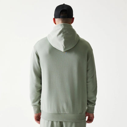 The model is wearing this NBA LA Lakers Oversized Pullover Hoodie in pastel green. 2