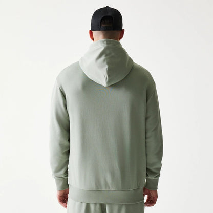The model is wearing this NBA LA Lakers Oversized Pullover Hoodie in pastel green. 2