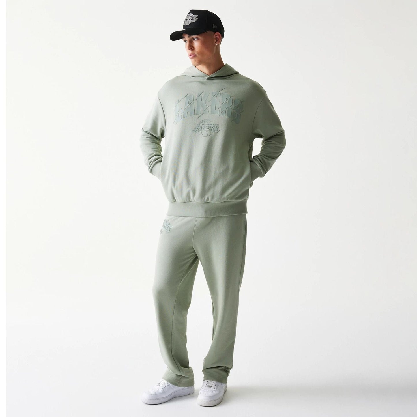 The model is wearing this NBA LA Lakers Oversized Pullover Hoodie in pastel green. 8