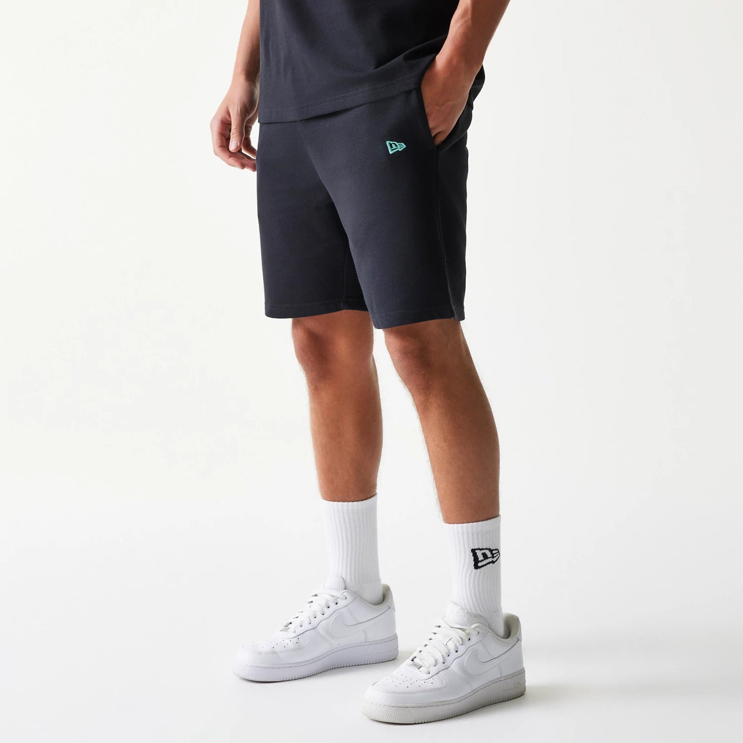 The model is wearing this NBA League Essential Chicago Bulls Shorts in black. 6