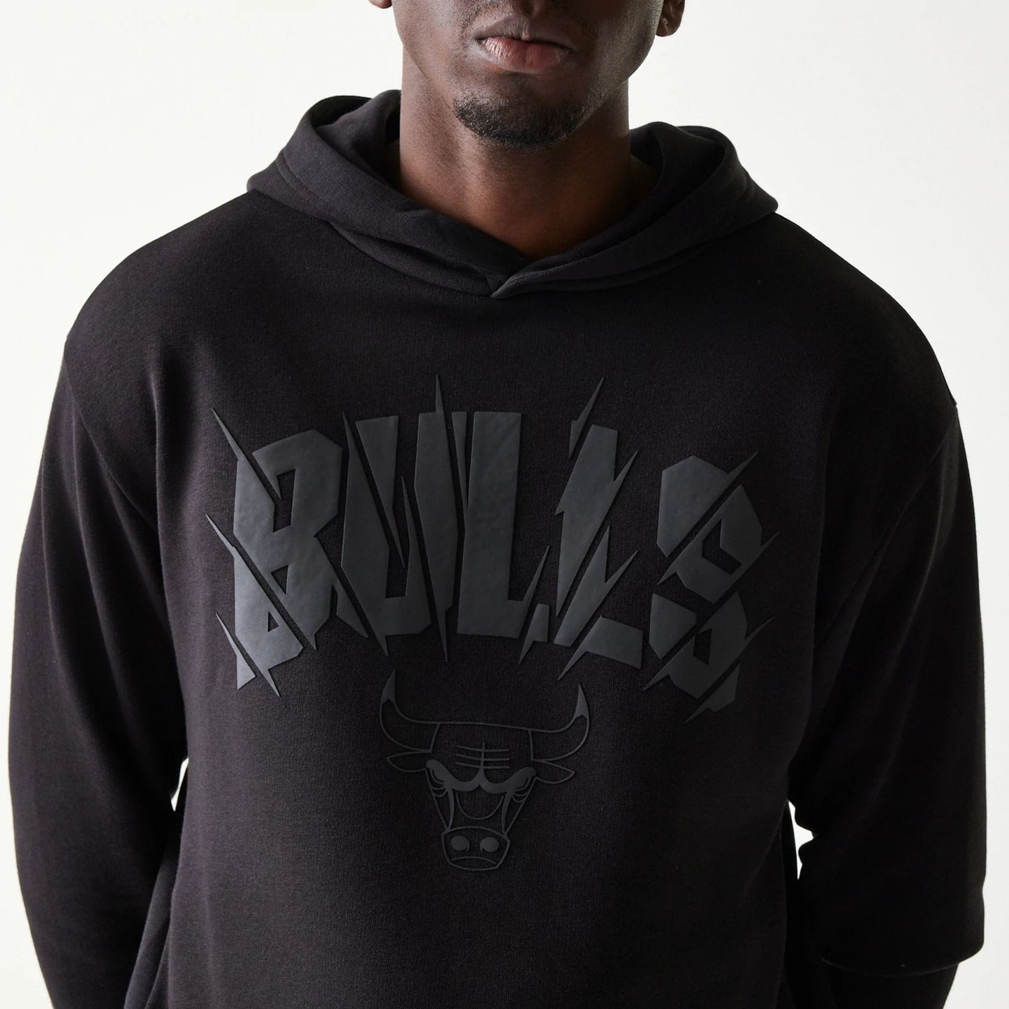 The model is wearing this NBA Chicago Bulls Oversized Pullover Hoodie in black. 6