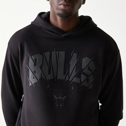 The model is wearing this NBA Chicago Bulls Oversized Pullover Hoodie in black. 6