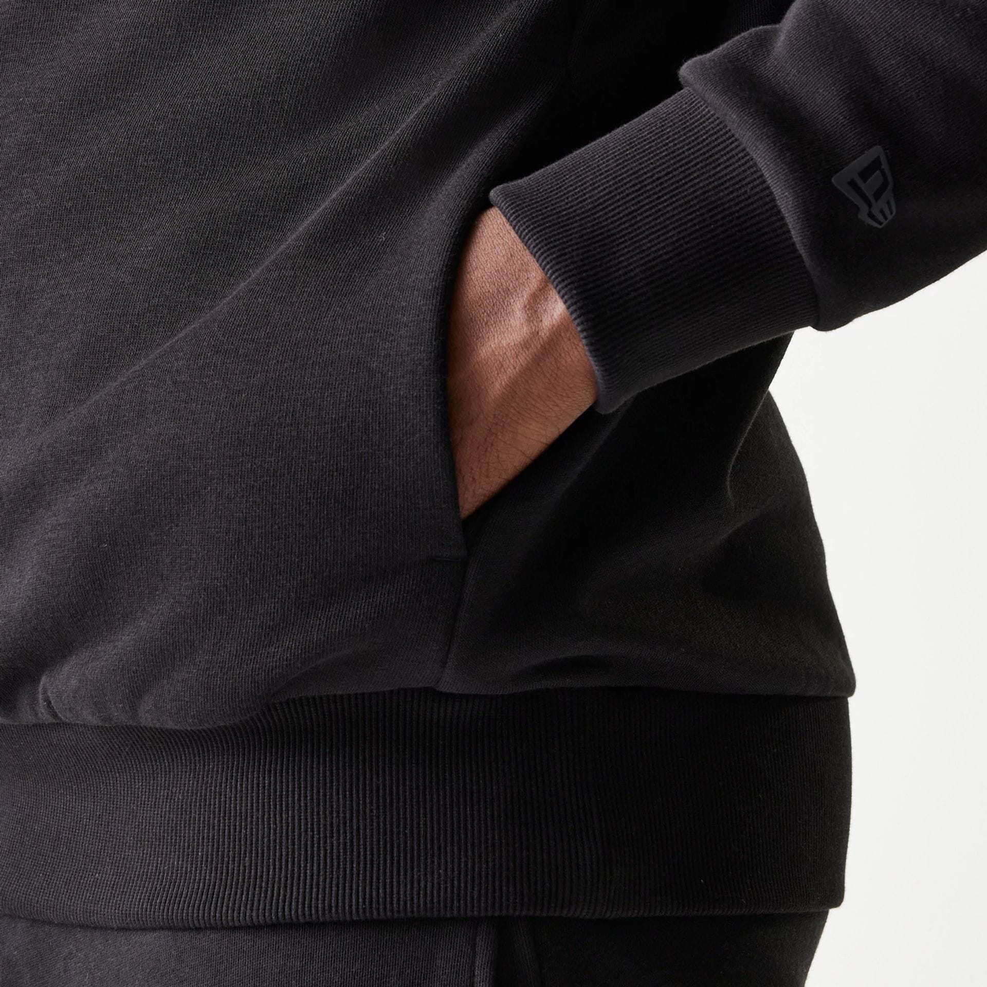 The model is wearing this NBA Chicago Bulls Oversized Pullover Hoodie in black. 7