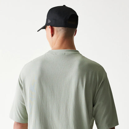 The model is wearing this NBA LA Lakers Oversized T-Shirt in pastel green. 7