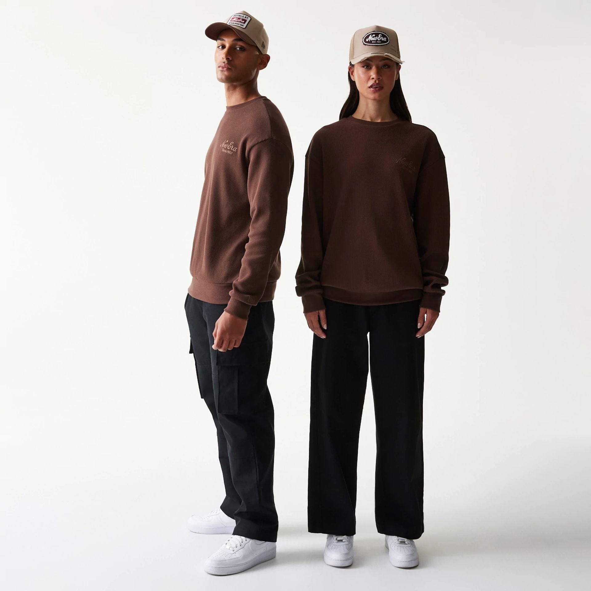 The model is wearing this New Era Script Waffle Crew Neck Sweater in brown. 1