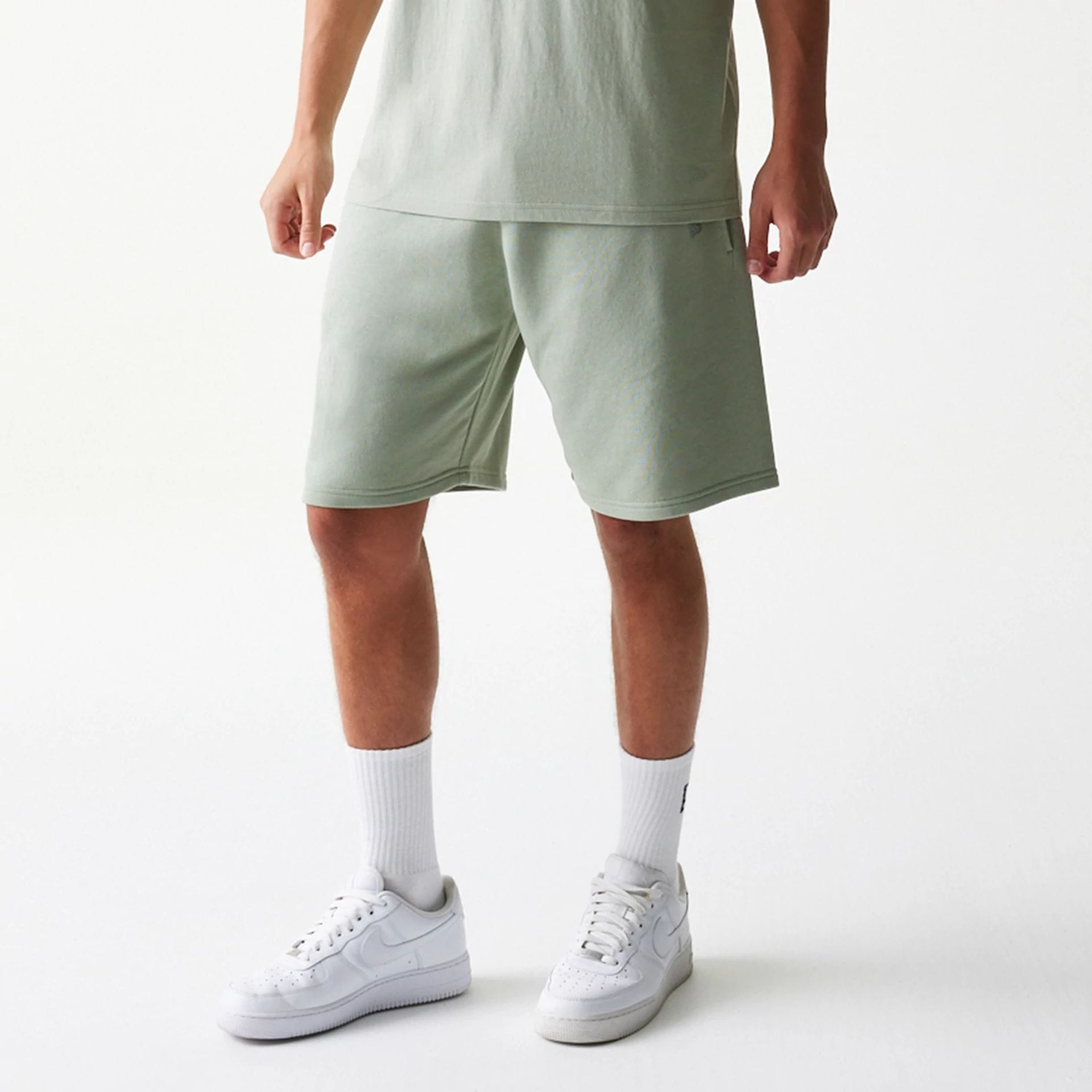 The model is wearing this NBA LA Lakers Shorts in pastel green. 4