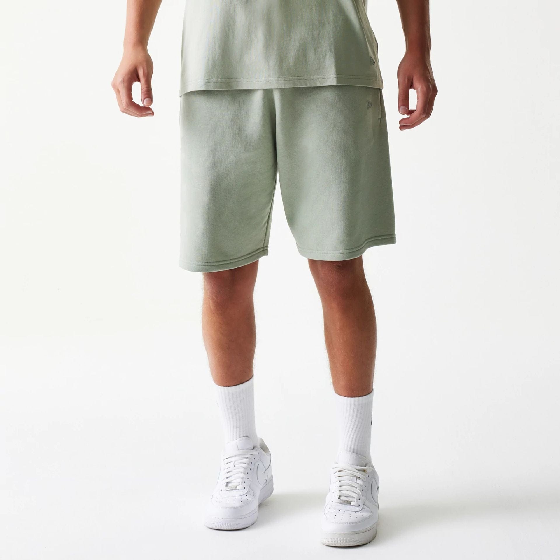 The model is wearing this NBA LA Lakers Shorts in pastel green. 1