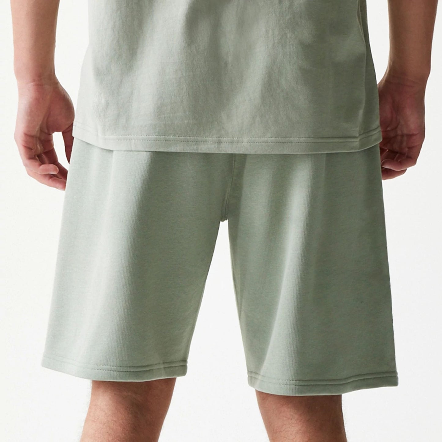 The model is wearing this NBA LA Lakers Shorts in pastel green. 7