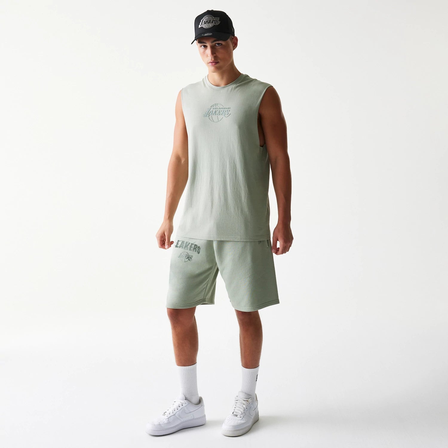 The model is wearing this NBA LA Lakers Shorts in pastel green. 8