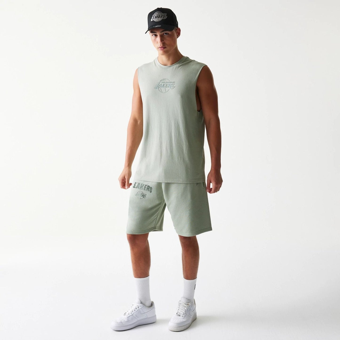 The model is wearing this NBA LA Lakers Shorts in pastel green. 8