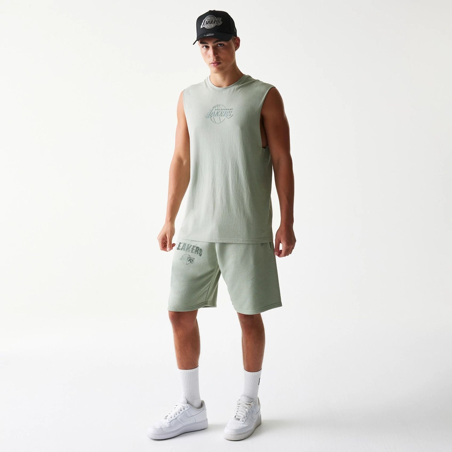 The model is wearing this NBA LA Lakers Shorts in pastel green. 8