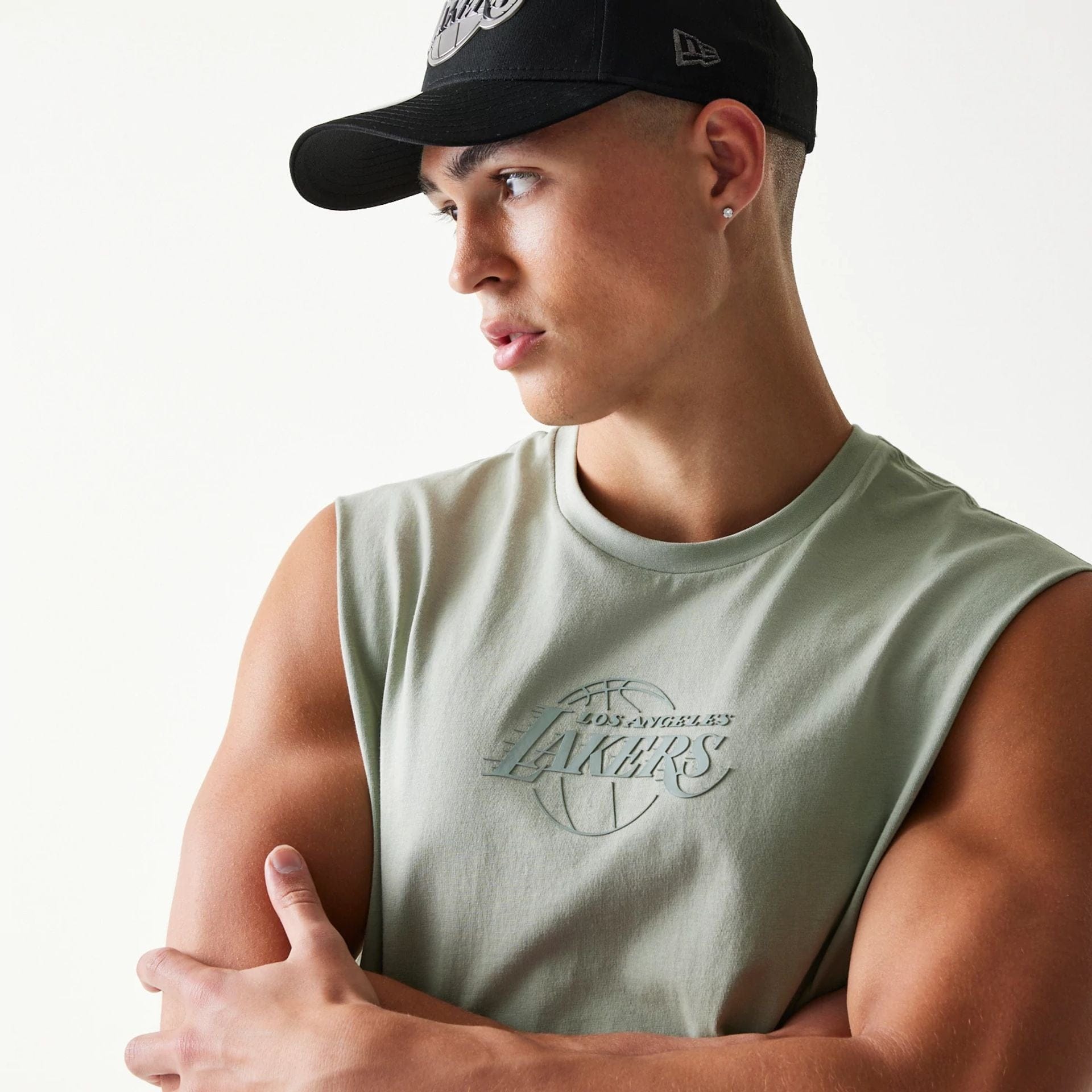 The model is wearing this NBA LA Lakers Sleeveless T-Shirt in pastel green. 4