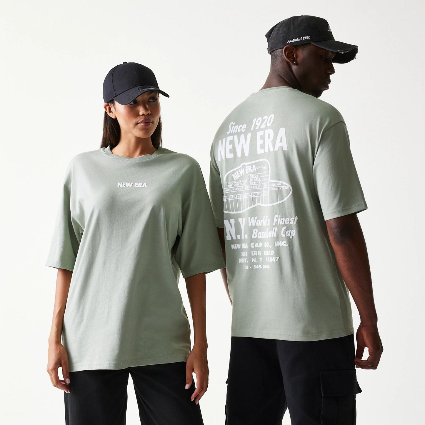 The model is wearing this New Era Graphic Oversized T-Shirt in pastel green. 1