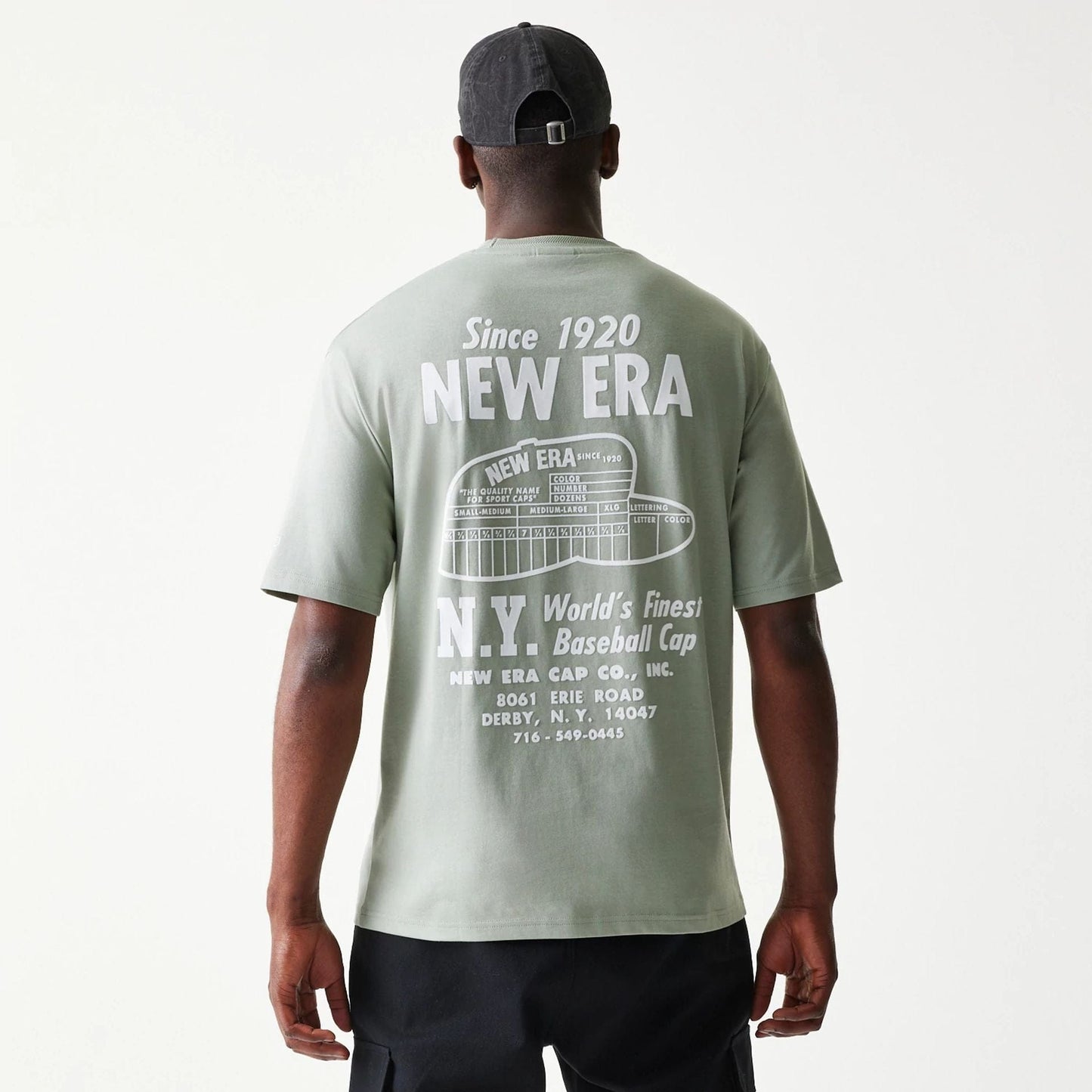 The model is wearing this New Era Graphic Oversized T-Shirt in pastel green. 2