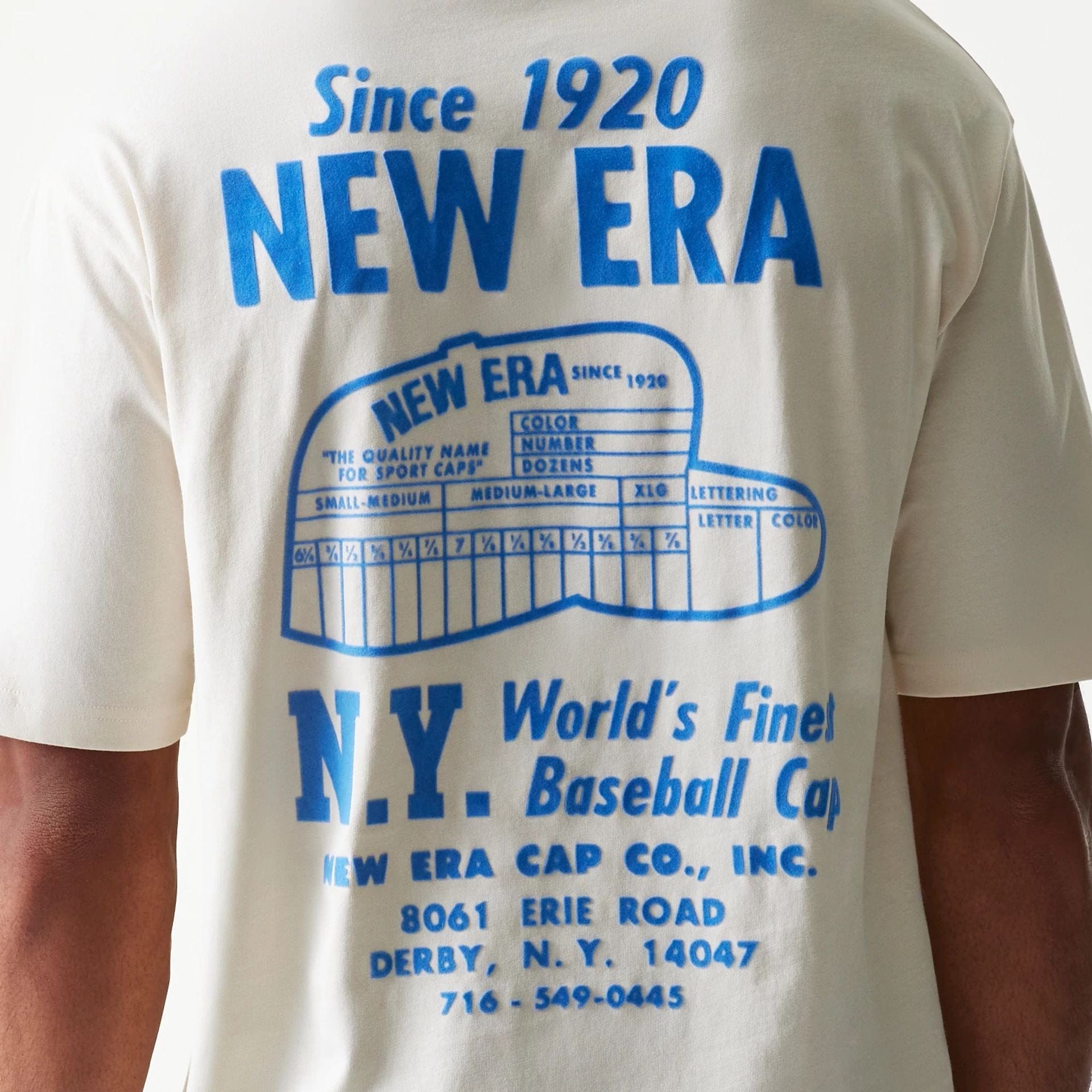 The model is wearing this New Era Graphic Oversized T-Shirt in light beige. 6