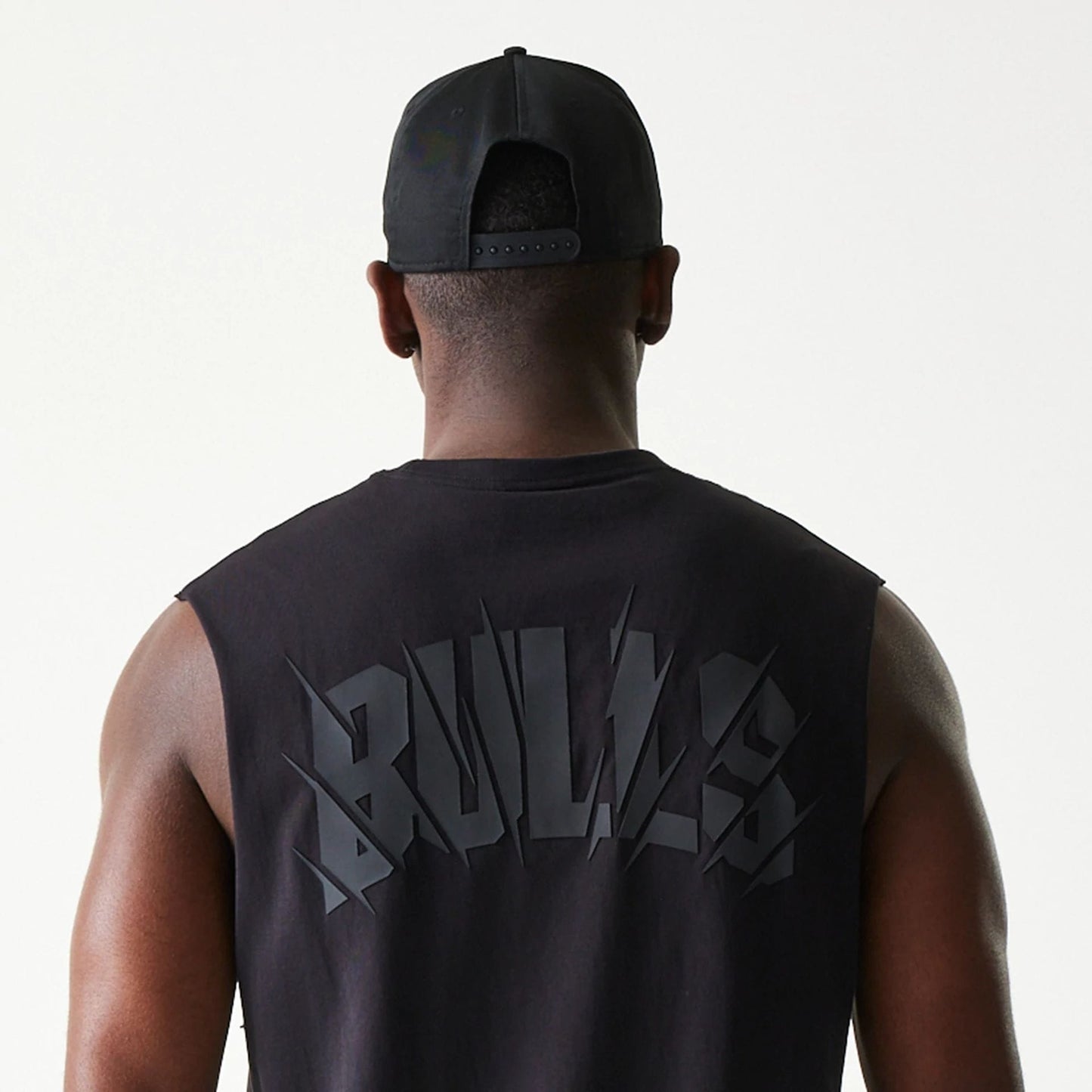 The model is wearing this NBA Chicago Bulls Sleeveless T-Shirt in black. 7