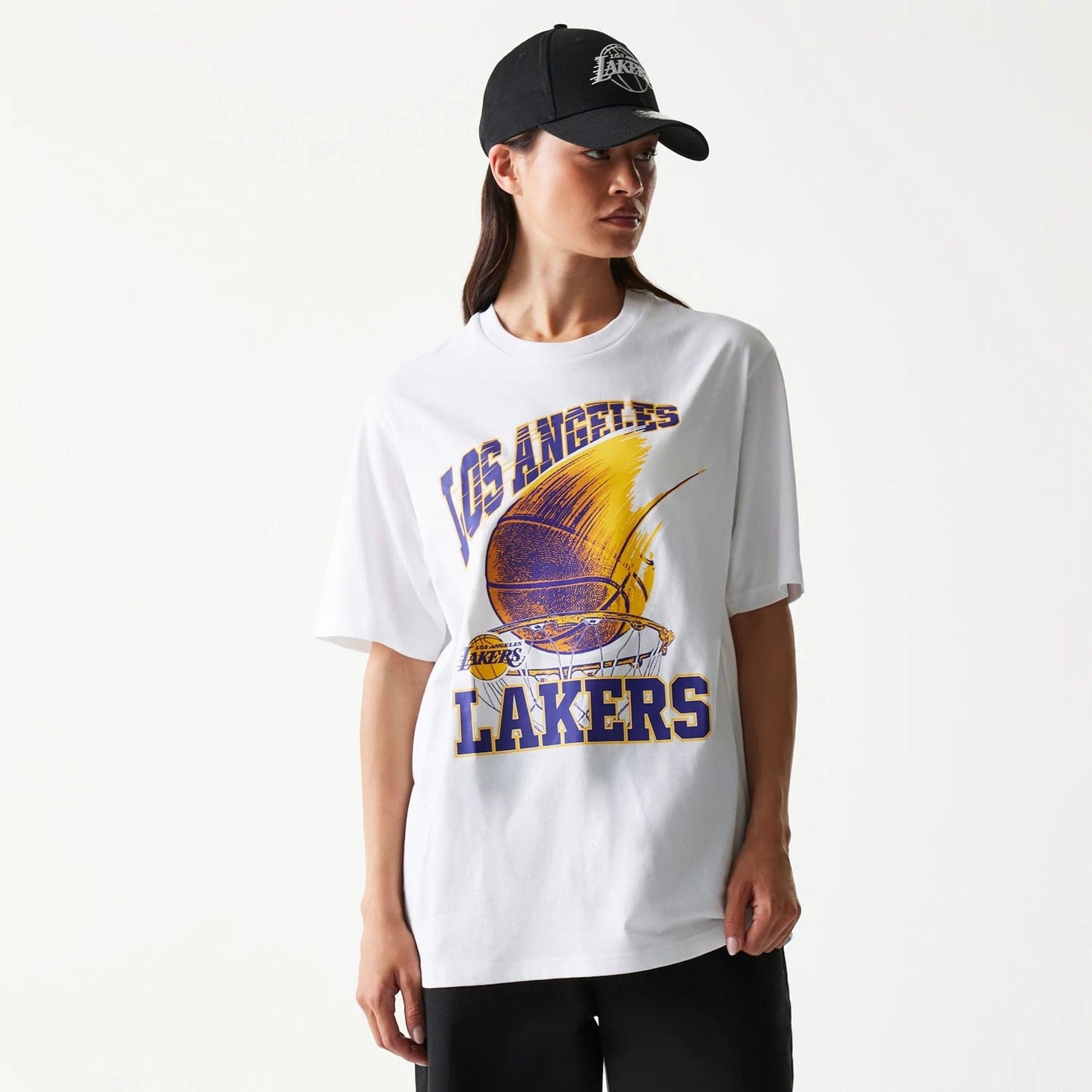 The model is wearing this NBA Ball Graphic LA Lakers T-Shirt in white. 4