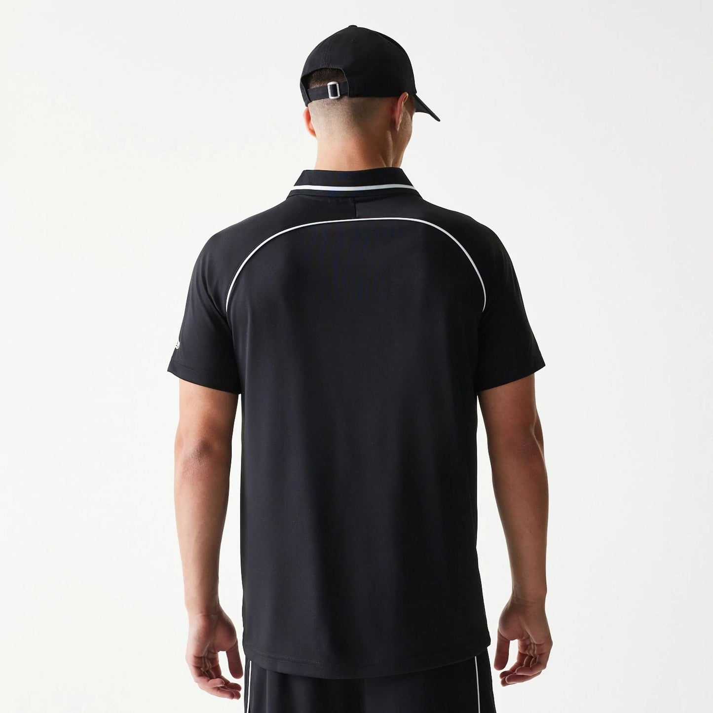 The model is wearing this New Era Football T-Shirt in black. 2