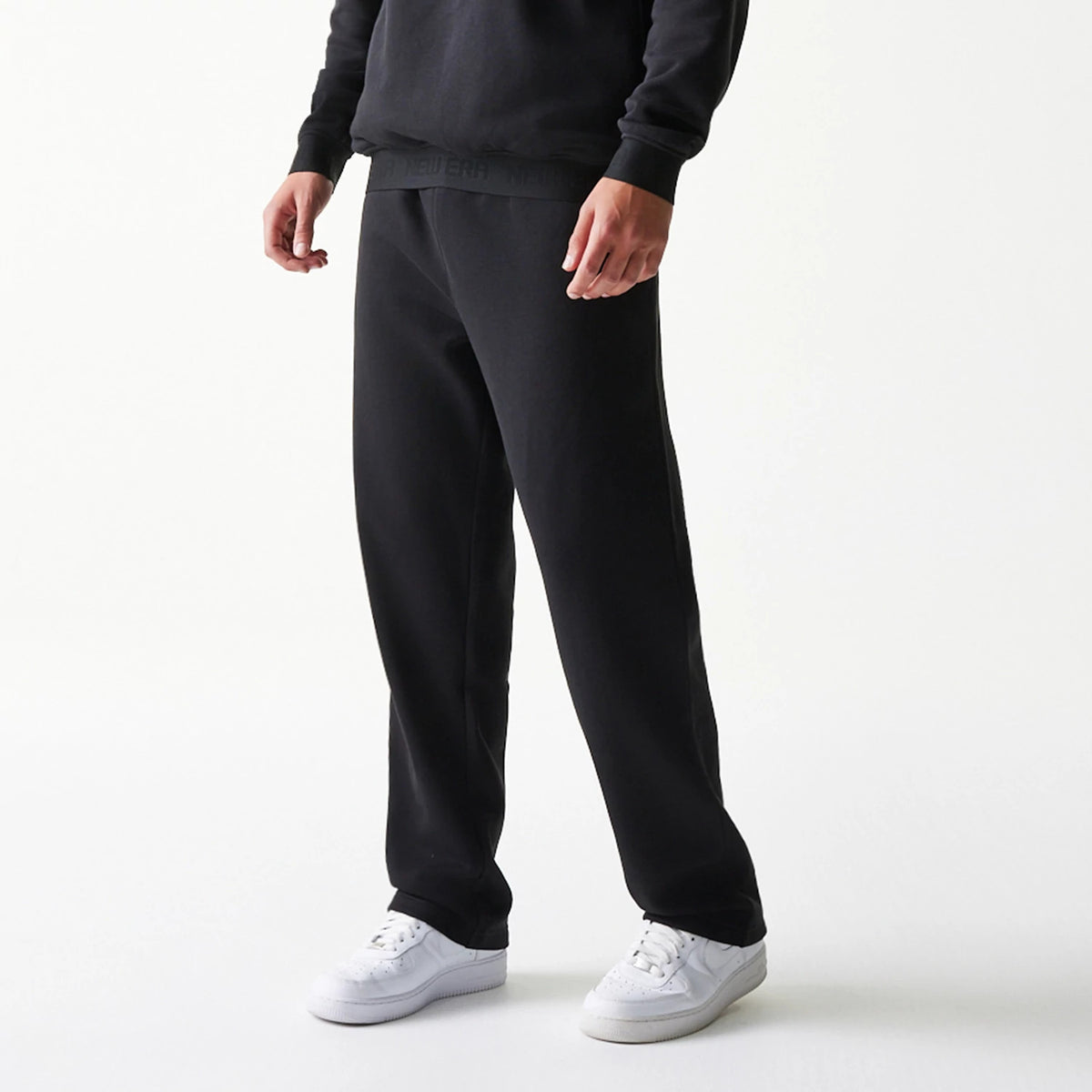 The model is wearing this New Era Tech Straight Leg Joggers in black on black. 3