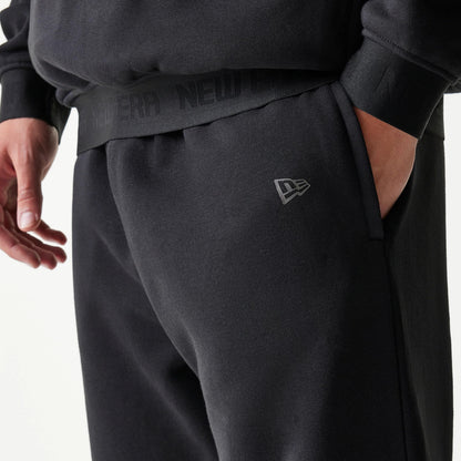 The model is wearing this New Era Tech Straight Leg Joggers in black on black. 5