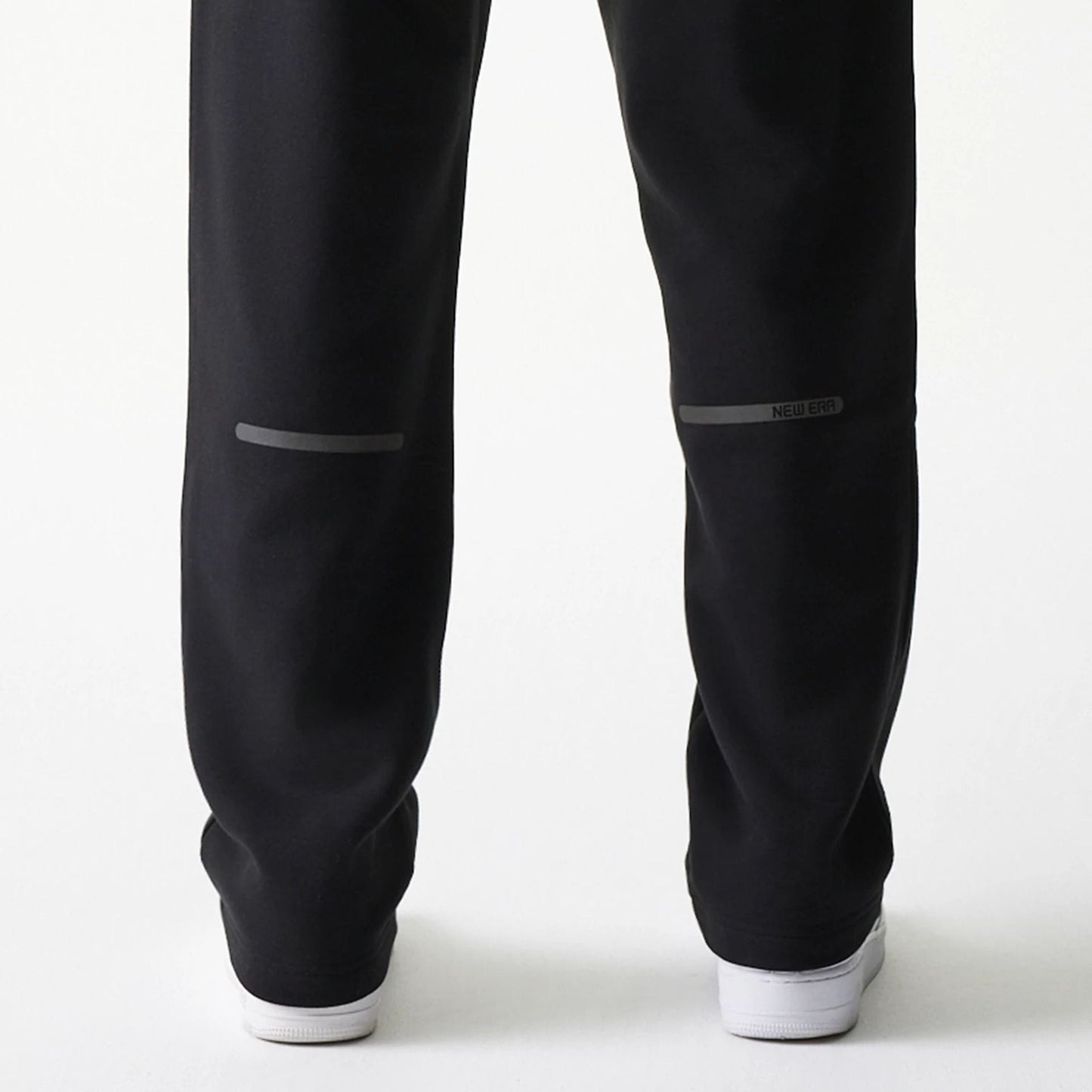 The model is wearing this New Era Tech Straight Leg Joggers in black. 7