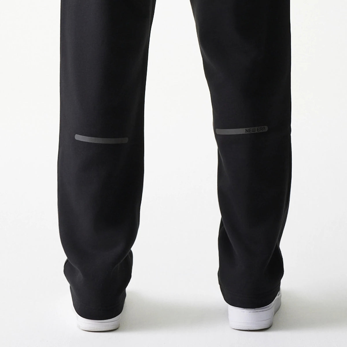 The model is wearing this New Era Tech Straight Leg Joggers in black on black. 7