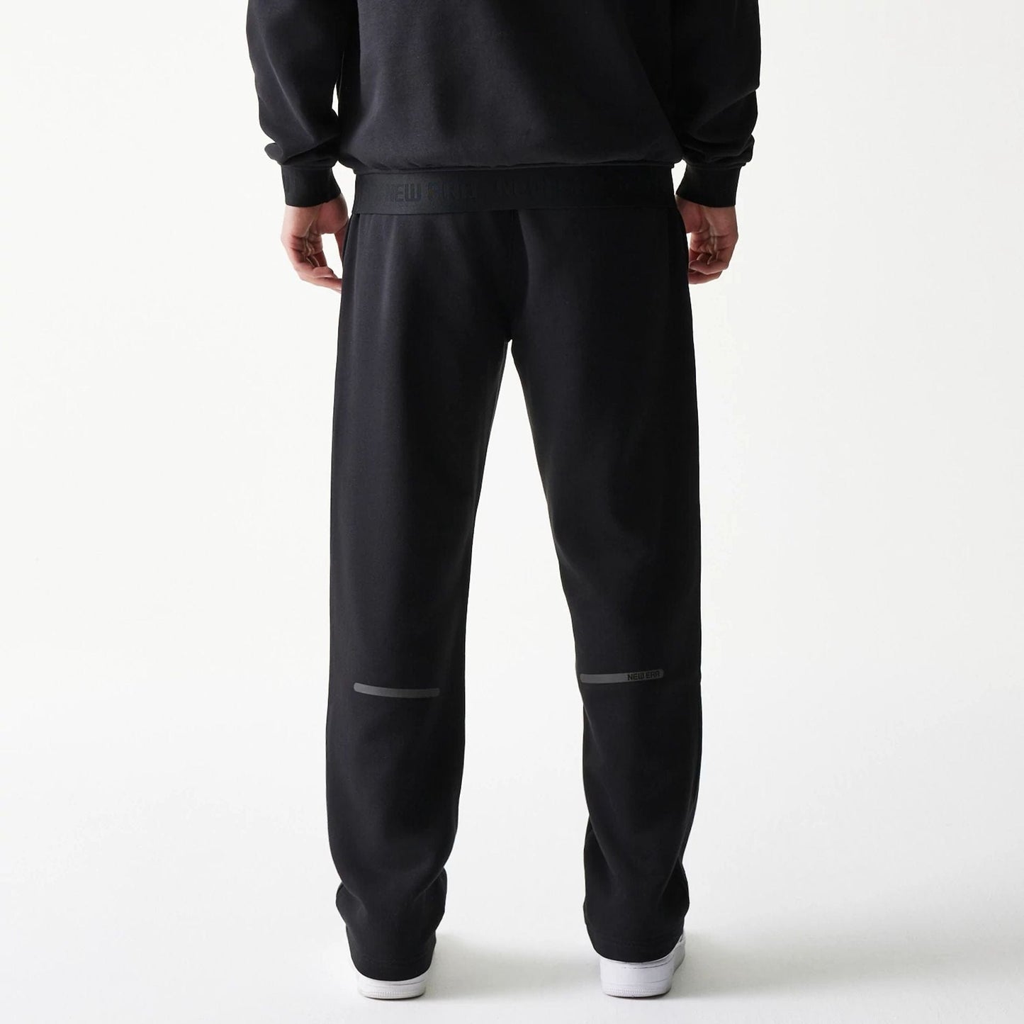 The model is wearing this New Era Tech Straight Leg Joggers in black. 2