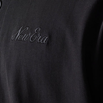 The model is wearing this New Era Script T-Shirt in black. 5