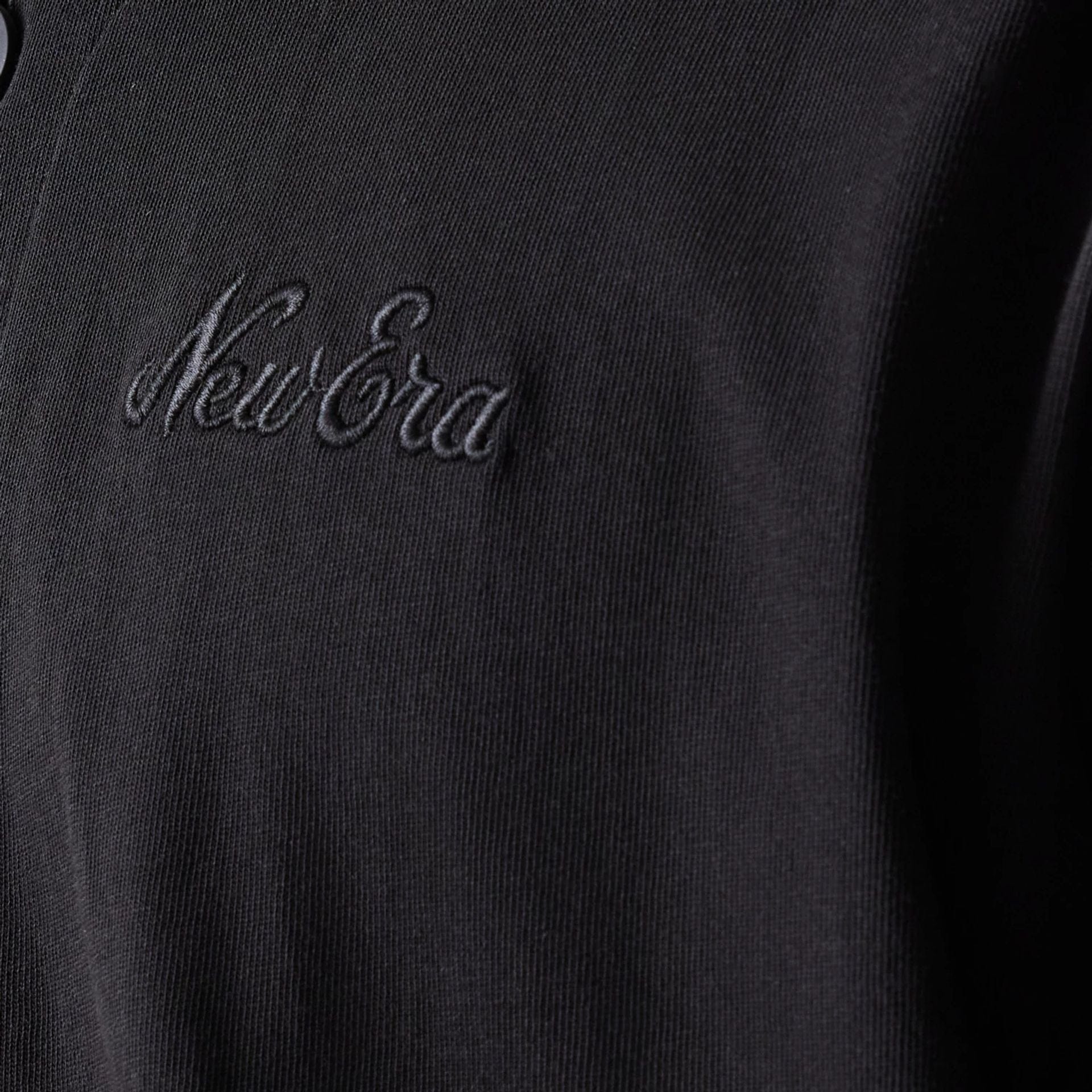 The model is wearing this New Era Script T-Shirt in black. 5
