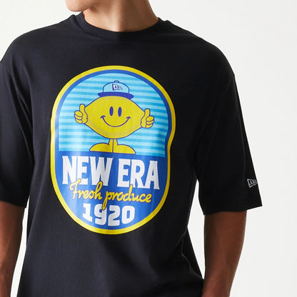 The model is wearing this New Era Lemon Fruit Graphic Oversized T-Shirt in black. 5
