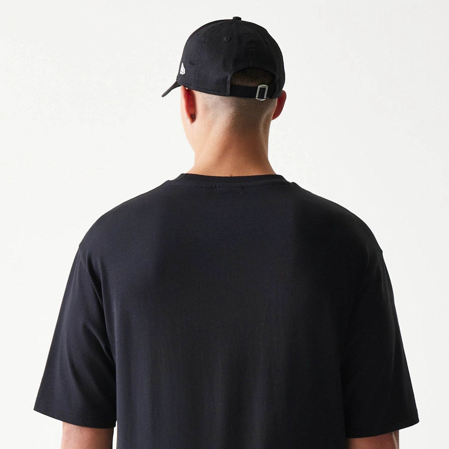 The model is wearing this New Era Lemon Fruit Graphic Oversized T-Shirt in black. 8