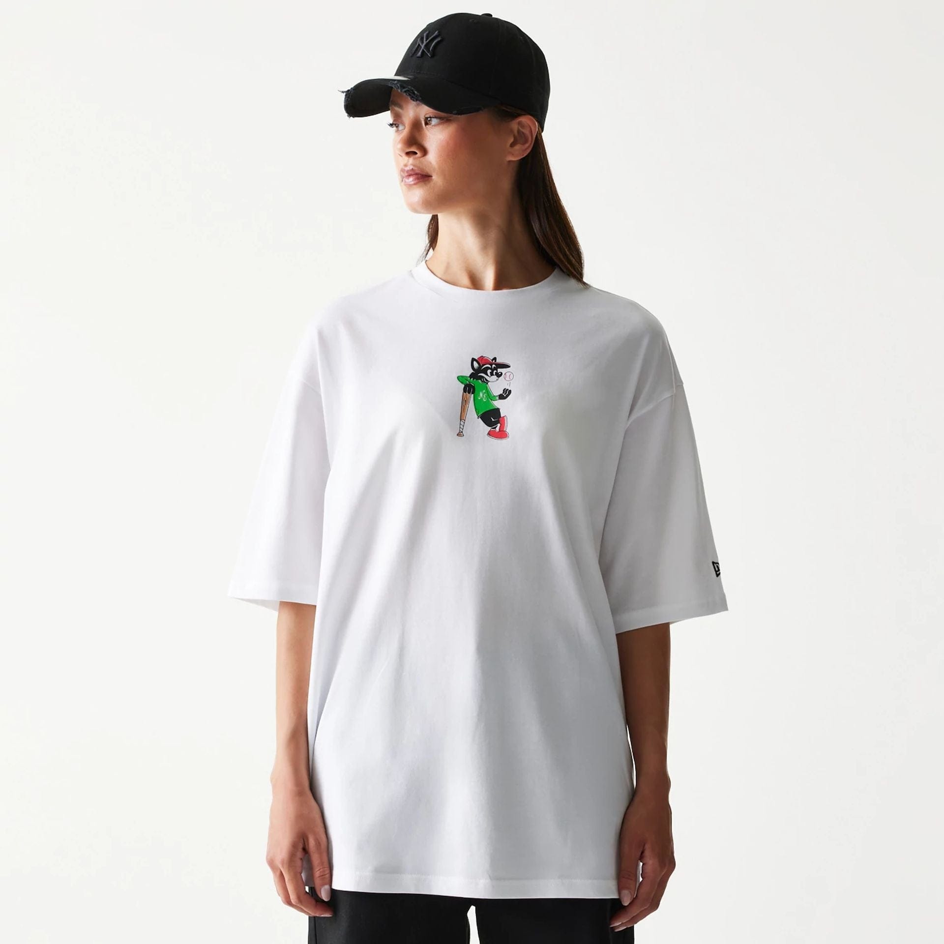 The model is wearing this New Era Baseball Cat Character Graphic Oversized T-Shirt in white. 4