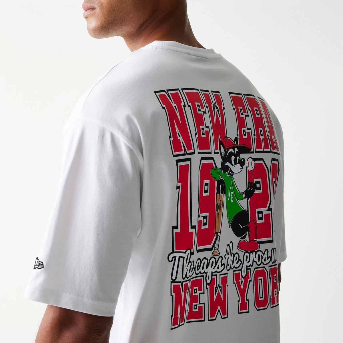 The model is wearing this New Era Baseball Cat Character Graphic Oversized T-Shirt in white. 7