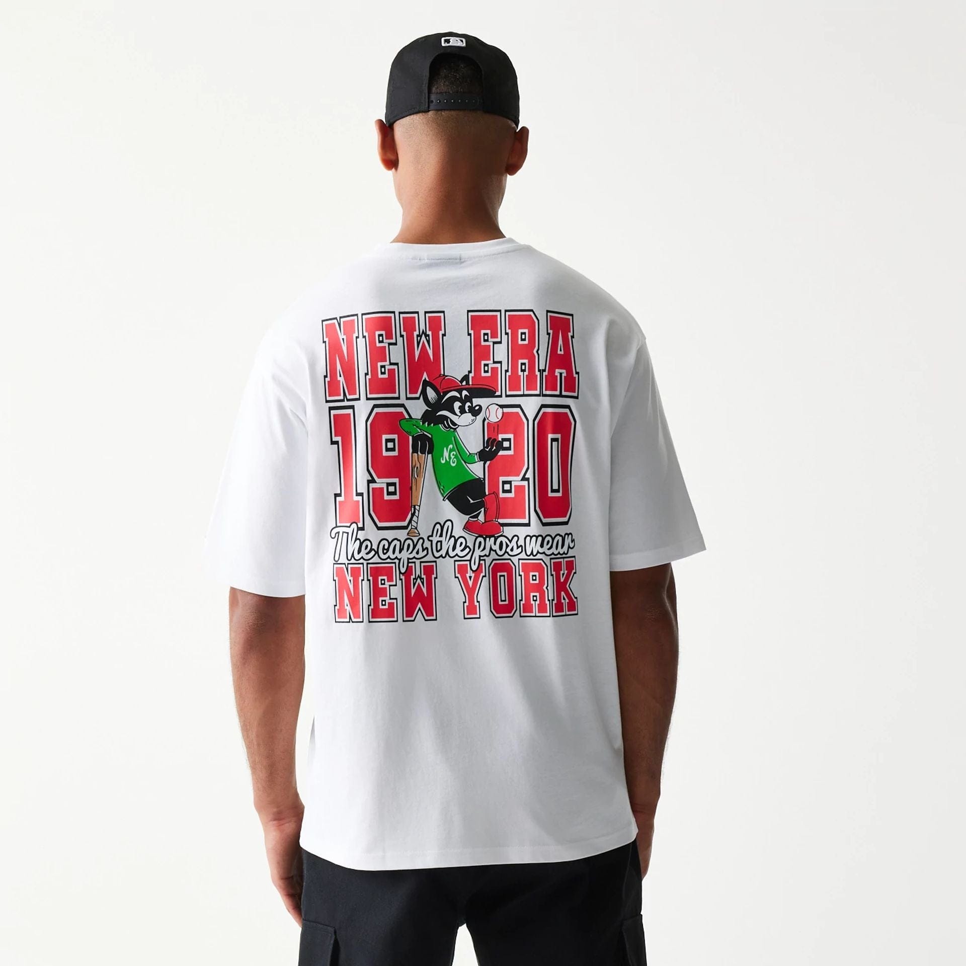 The model is wearing this New Era Baseball Cat Character Graphic Oversized T-Shirt in white. 2