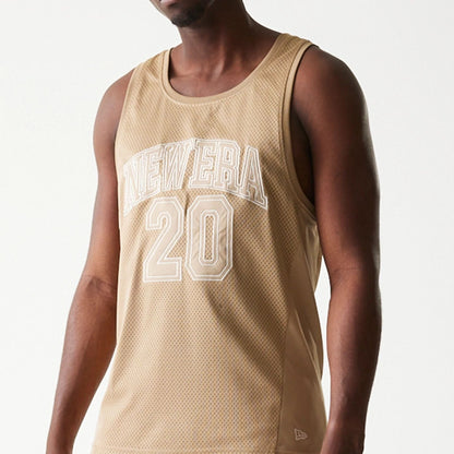 The model is wearing this New Era Mesh Tank Top in light beige. 5