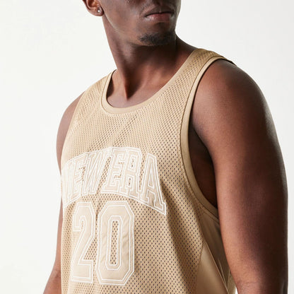 The model is wearing this New Era Mesh Tank Top in light beige. 6