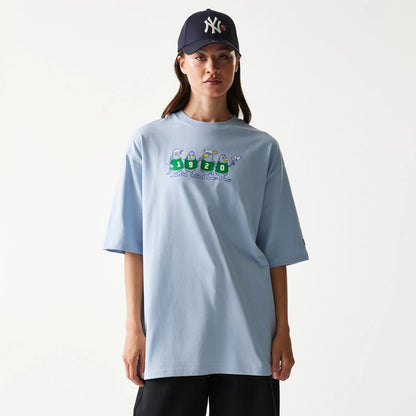 The model is wearing this New Era Baseball Birds Character Graphic Oversized T-Shirt in pastel blue. 4
