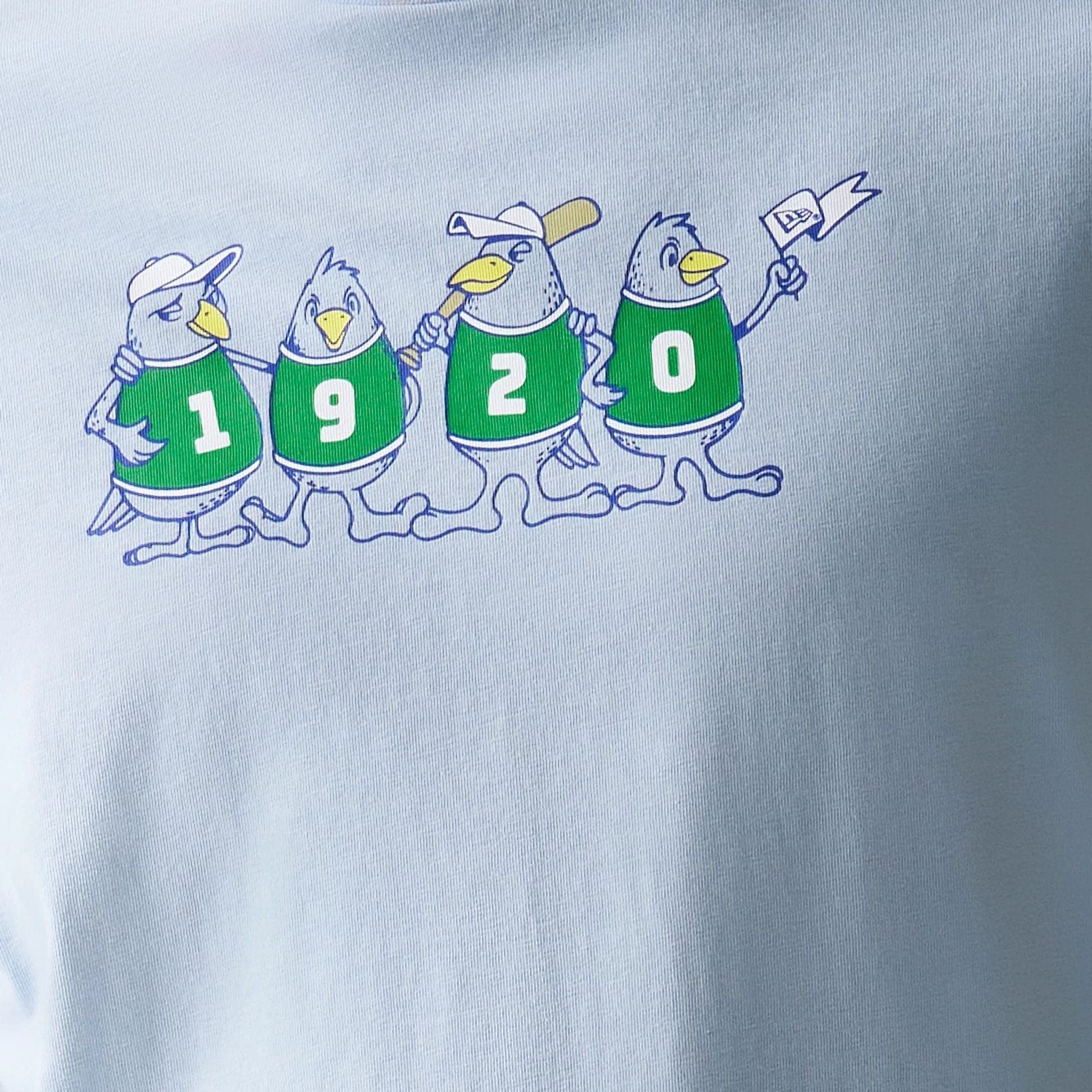 The model is wearing this New Era Baseball Birds Character Graphic Oversized T-Shirt in pastel blue. 6