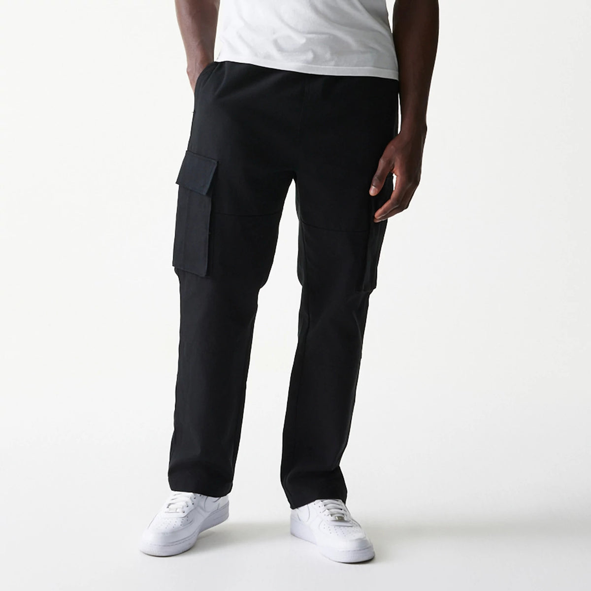The model is wearing this New Era Straight Leg Cargo Joggers in black. 1