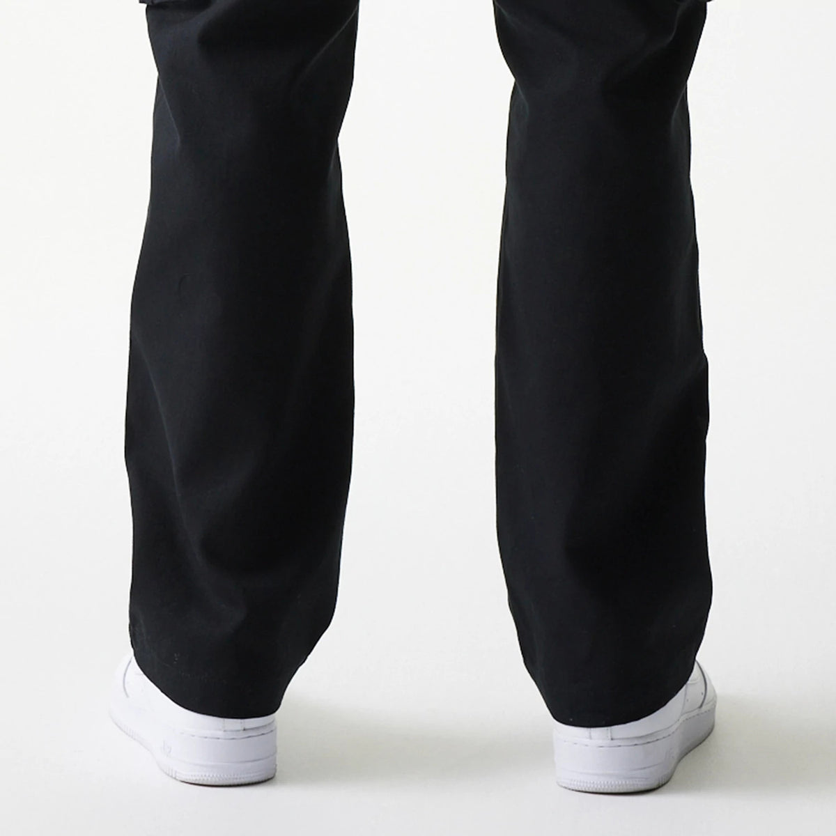 The model is wearing this New Era Straight Leg Cargo Joggers in black. 7