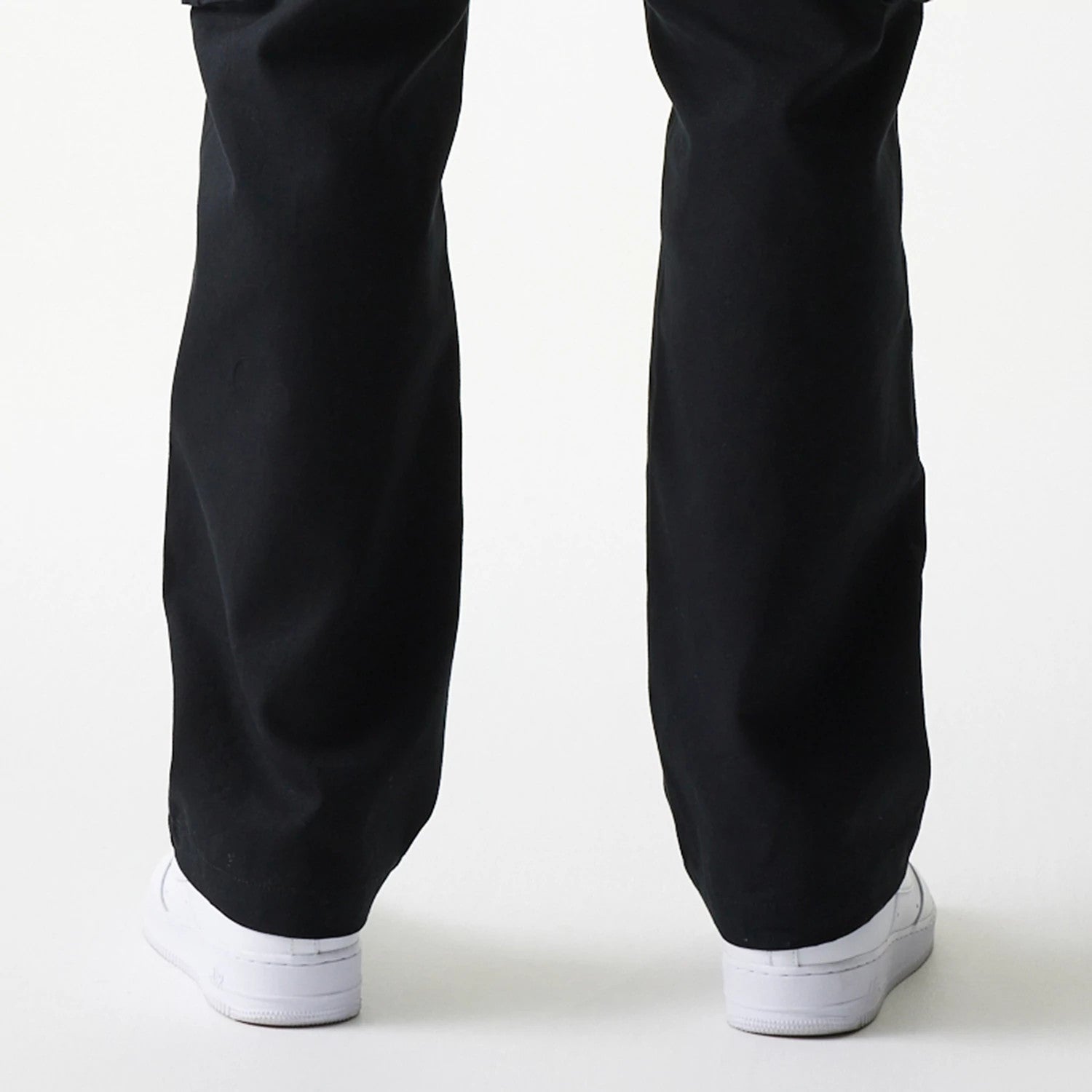 The model is wearing this New Era Straight Leg Cargo Joggers in black. 7
