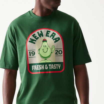 The model is wearing this New Era Pear Fruit Graphic Oversized T-Shirt in dark green. 5