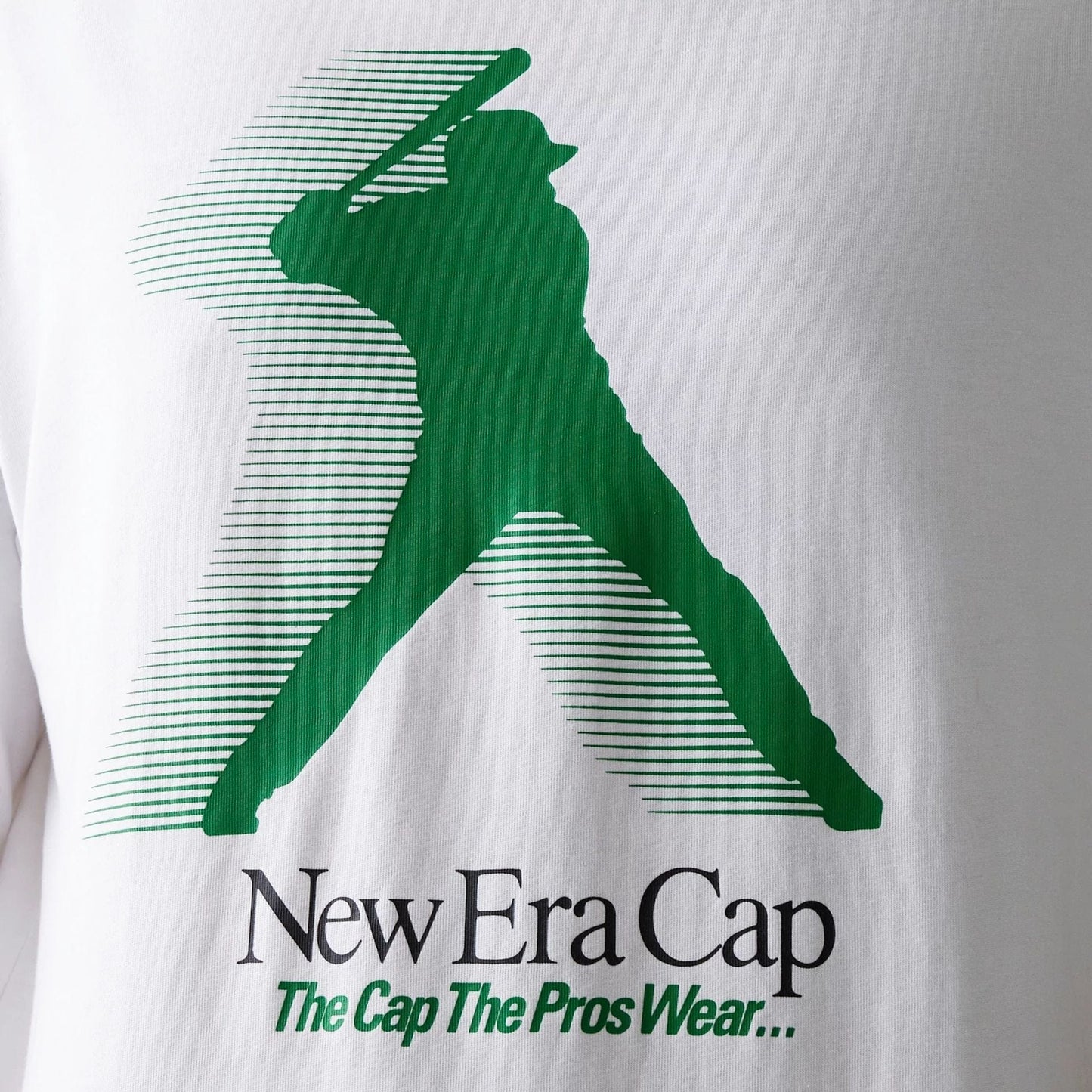The model is wearing this New Era Baseball Player Graphic Oversized T-Shirt in white. 4