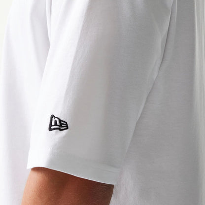 The model is wearing this New Era Baseball Player Graphic Oversized T-Shirt in white. 5