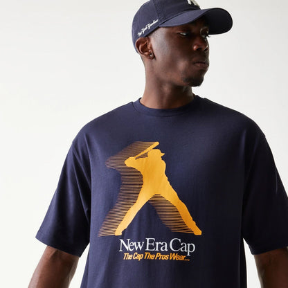 The model is wearing this New Era Baseball Player Graphic Oversized T-Shirt in navy. 6