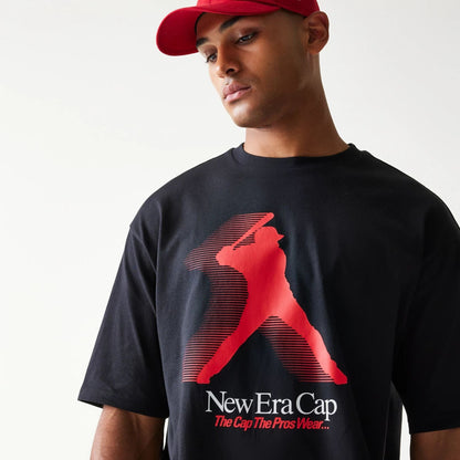 The model is wearing this New Era Baseball Player Graphic Oversized T-Shirt in black. 3