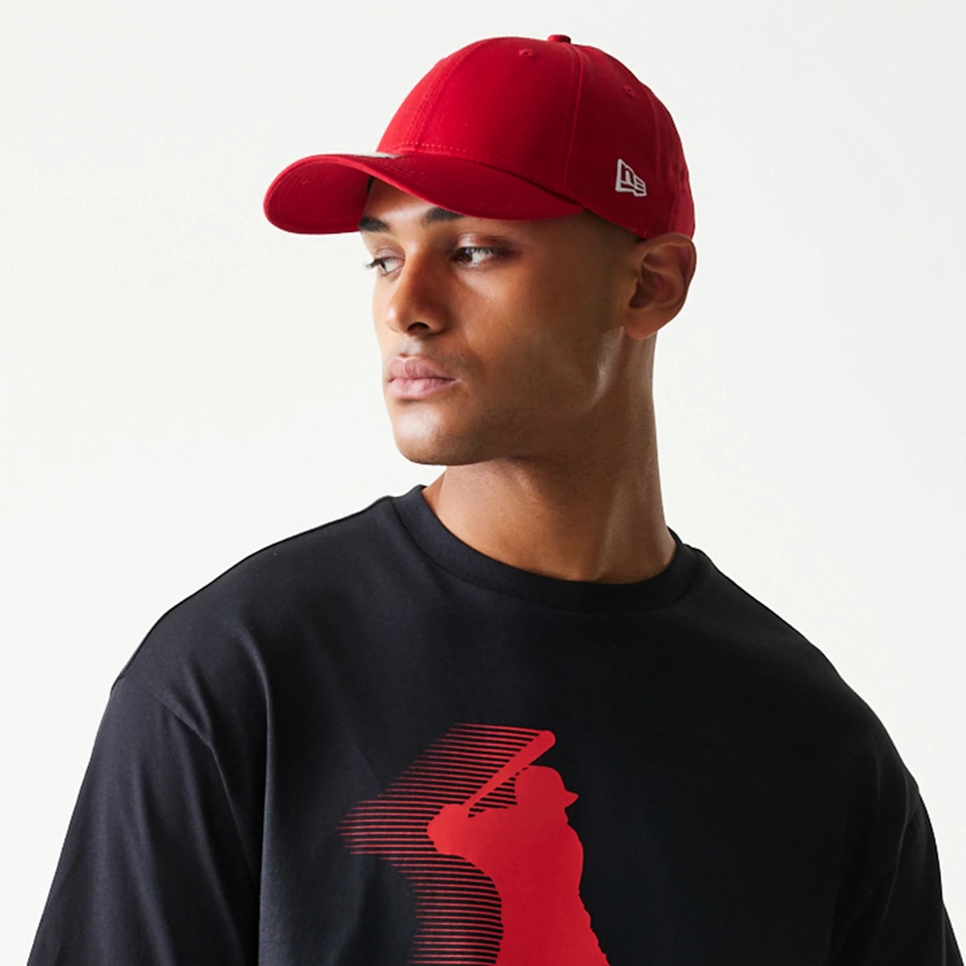 The model is wearing this New Era Baseball Player Graphic Oversized T-Shirt in black. 4